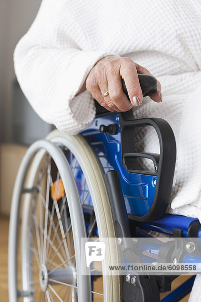 Senior woman sitting on wheelchair