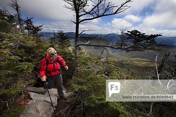 An athletic female hikes the Franconia Ridge Trail.
