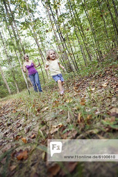 A mother and her young daughter hike through trails in Chelsea  Alabama.