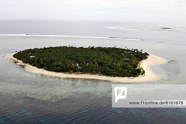 Waves reel across from the island of Tavarua  Fiji in this aerial view