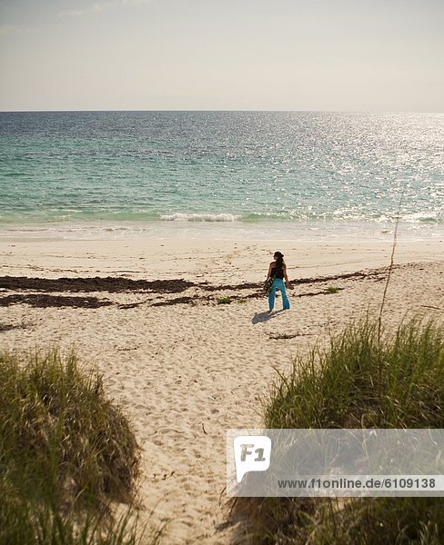 A woman on a beach  Elbow Cay  Hopetown  Bahamas