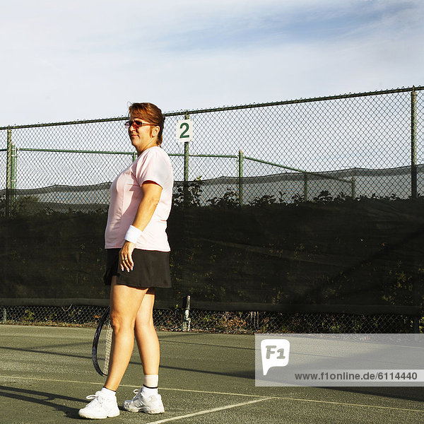 Woman playing tennis in Ft. Pierce  Florida.