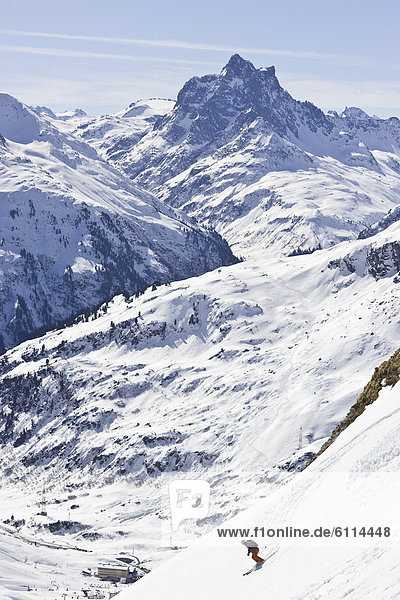 A young man skis down a steep slope at St. Anton am Arlberg  Austria.