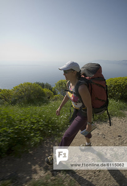 A woman hiking  Sardinia  Italy.