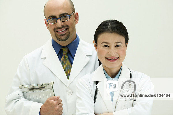 Portrait of male and female doctors smiling