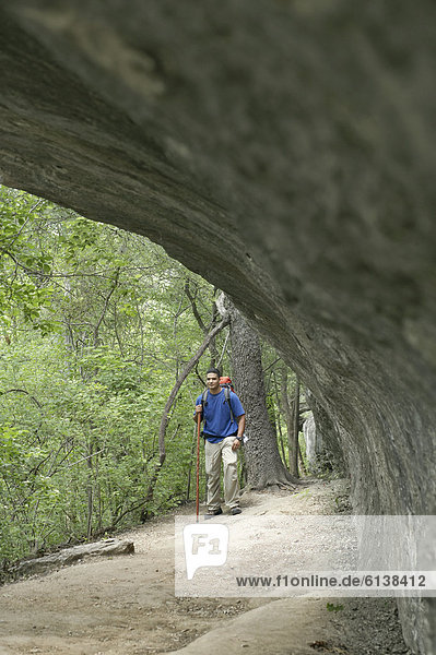 Young man hiking in a forest