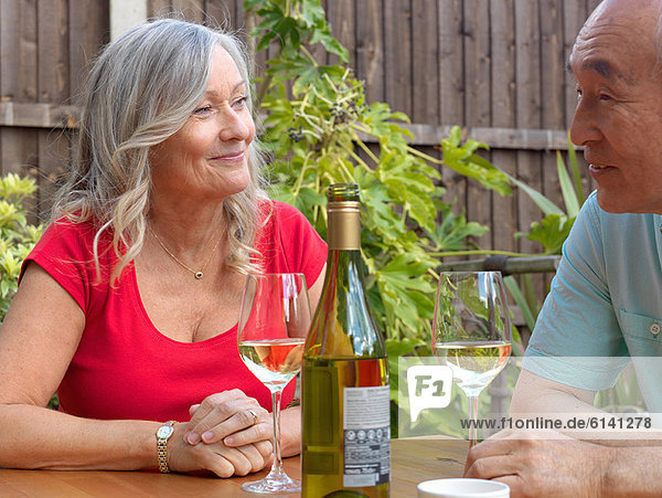 Older couple drinking wine together