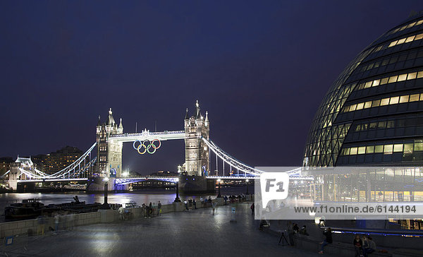 Illuminated Tower Bridge with the Olympic Rings to mark the Olympic Games in London in 2012  City Hall  right  London  England  United Kingdom  Europe