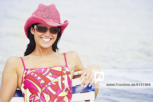 Woman wearing hat at beach