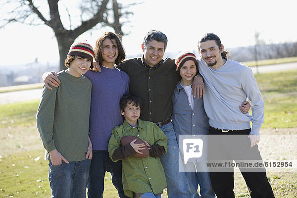 Portrait of Hispanic family at park