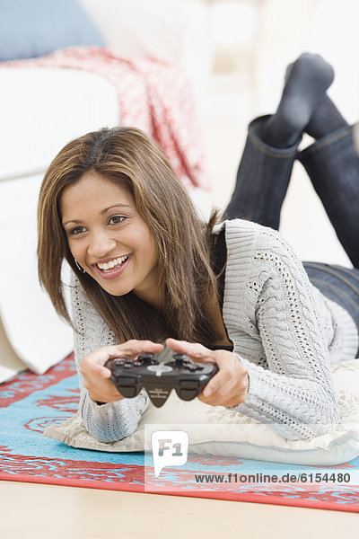Indian woman playing video game