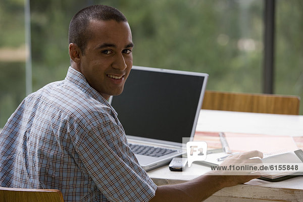 Young businessman working from home