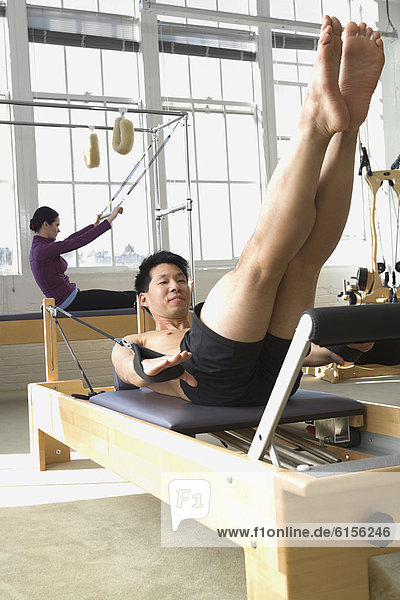 People stretching in exercise studio