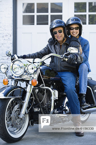 Senior African American couple on motorcycle