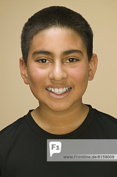Close up of Hispanic boy smiling