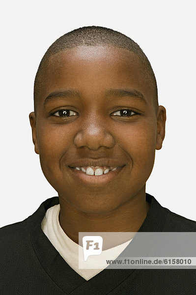 Close up of African American boy smiling