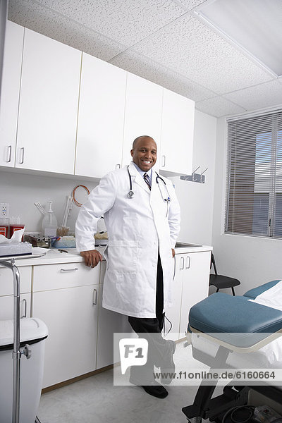 African American male doctor in examining room