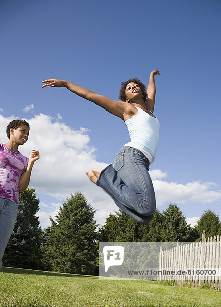 African American woman jumping