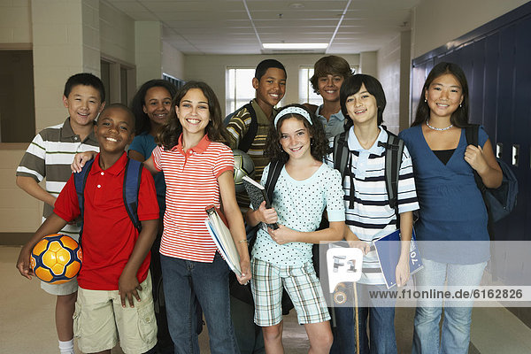 Group of multi-ethnic students in hallway