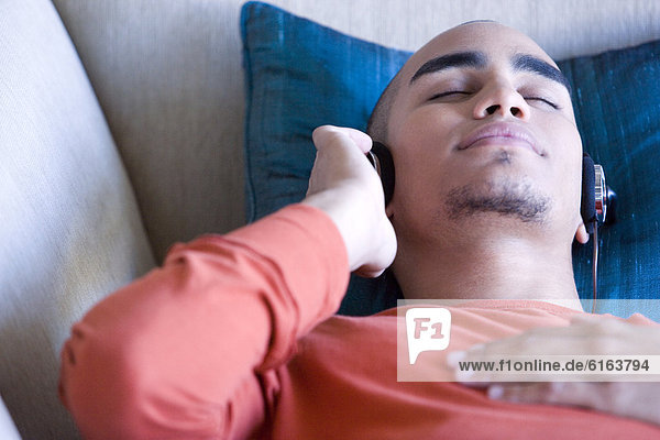 African American man listening to headphones