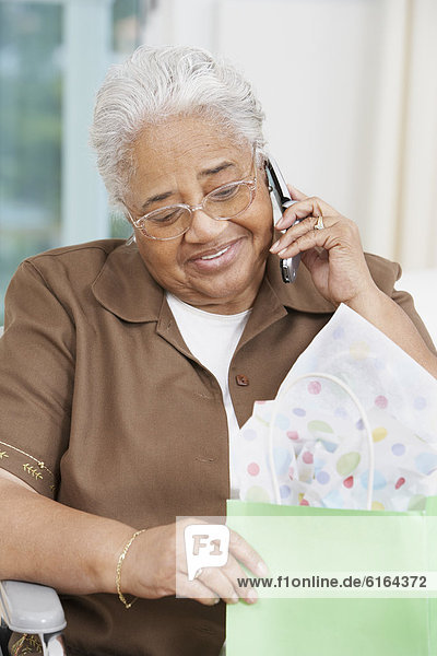 Senior African American woman talking on cell phone