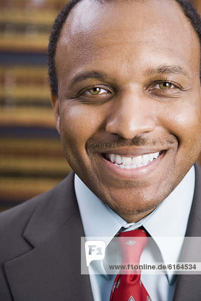Close up of African American businessman smiling