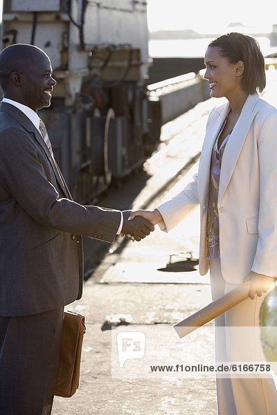 African American businesspeople shaking hands
