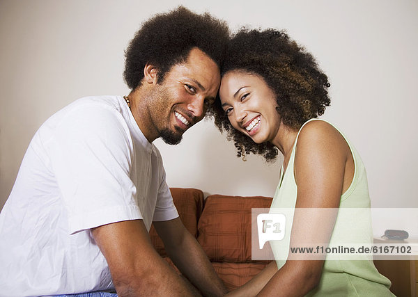 African couple touching foreheads