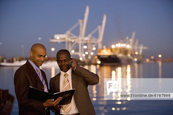 African American businessmen looking at paperwork