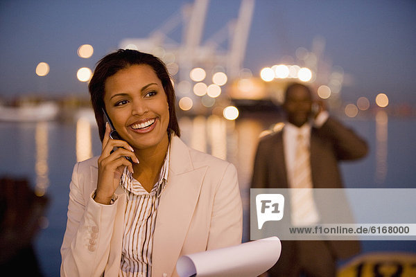 African American businesswoman talking on cell phone