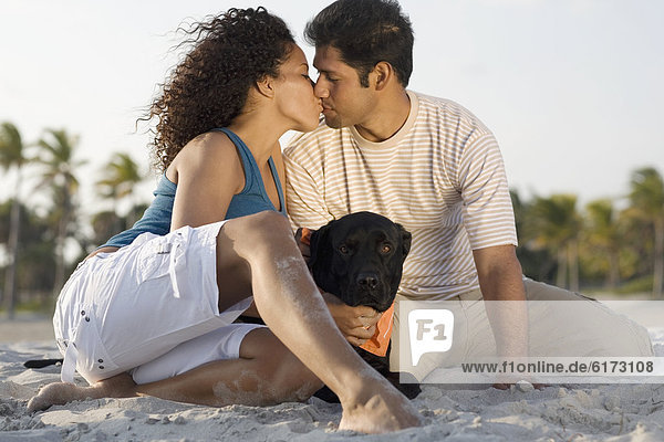 Hispanic couple kissing