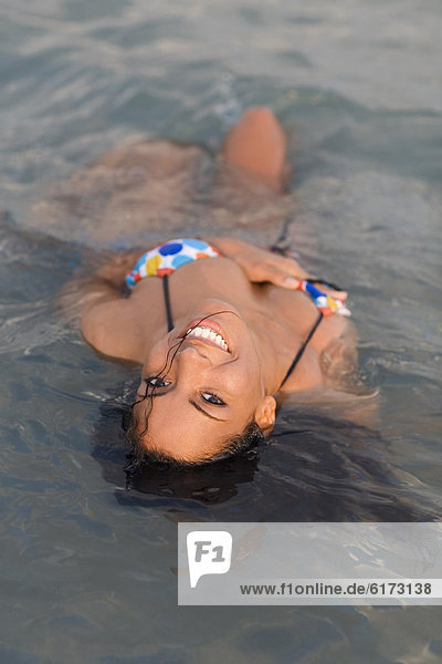 Hispanic woman in water