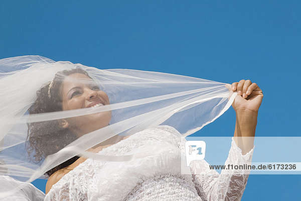 Low angle view of Hispanic bride