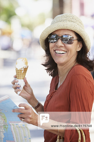 Middle-aged Hispanic woman with ice cream cone
