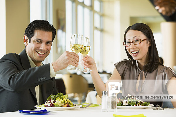 Couple toasting at restaurant