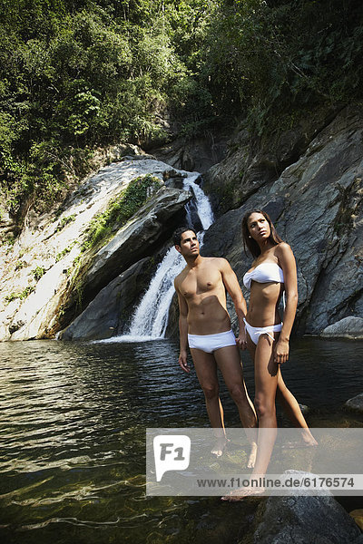 Hispanic couple in bathing suits