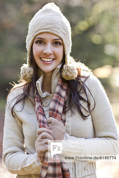 Mixed race woman in cap  scarf and gloves