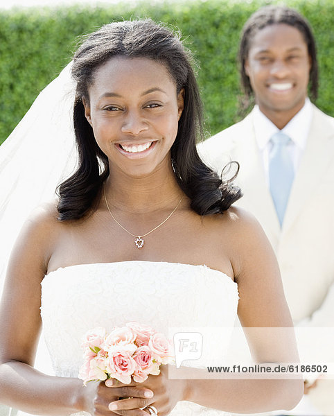 African bride holding bouquet