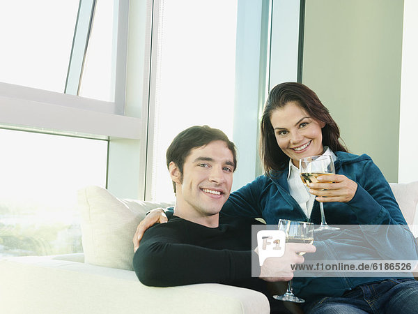 Couple sitting together and drinking wine