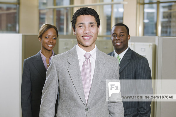 Multi-ethnic business people posing in office