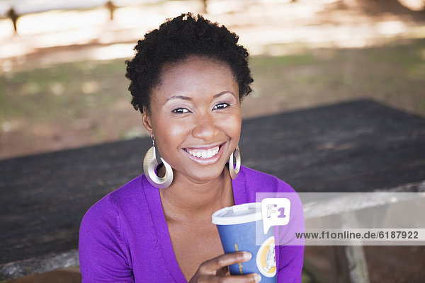 African American woman drinking coffee