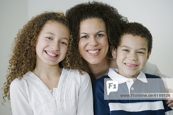 Mixed race family smiling