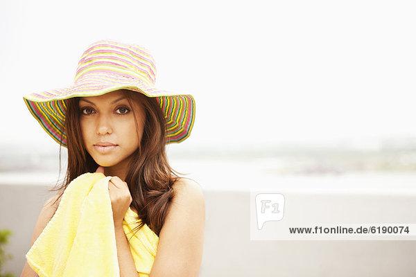 Hispanic woman enjoying the beach