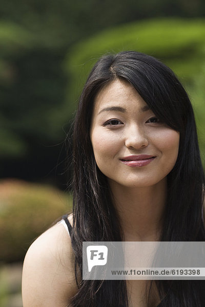 Confident Japanese woman smiling