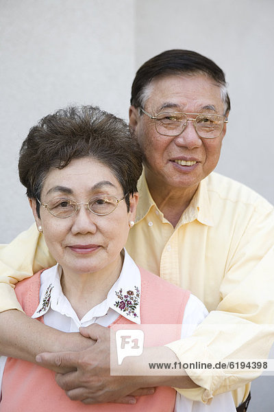 Senior Chinese couple hugging