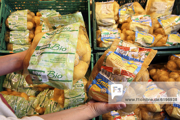 Organic potatoes and conventionally cultivated potatoes  food hall  supermarket  Germany  Europe
