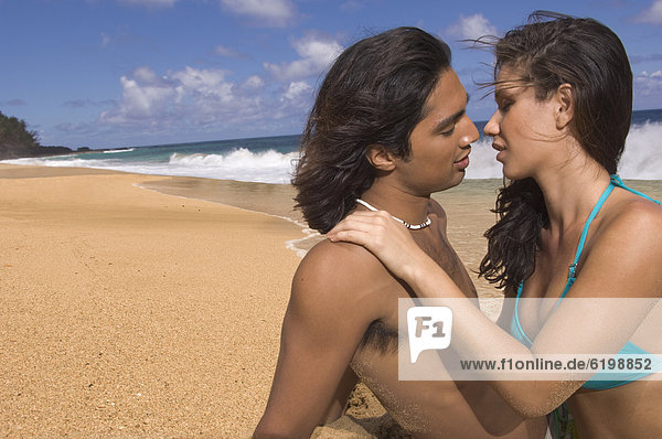 Couple kissing at beach