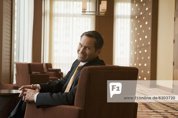 Businessman smiling in lobby
