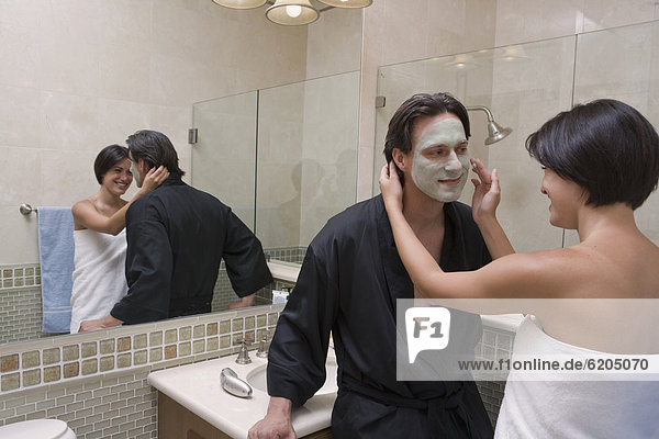 Hispanic couple in bathroom