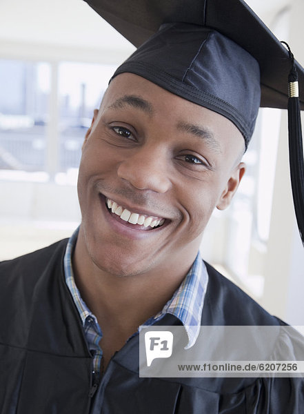 African man in graduation cap and gown